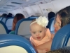 Annie plays hide and seek on the plane home